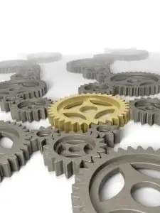 Interlocking gears highlighting innovation and teamwork, with a central gold gear symbolizing leadership.