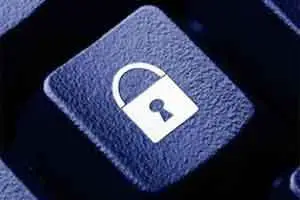Close-up of a keyboard key with a lock icon symbolizing digital security and access control.
