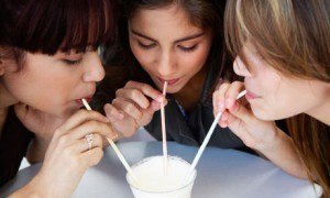 Sharing a milkshake