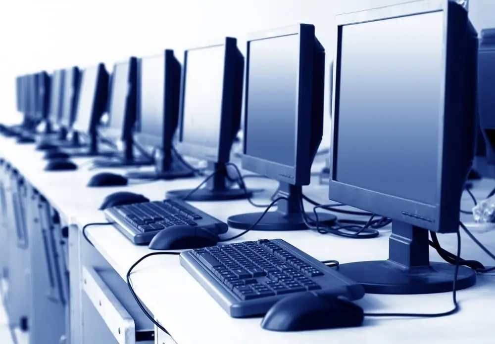 Let Our Business It Support On Long Island Help You Prevent Downtime 9 modern workspace with desktop computers ready for it support and increased productivity.