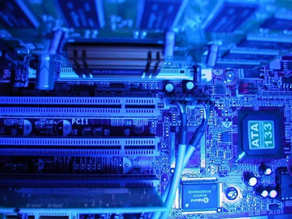 Disaster Recovery Colocation 5 close-up of a blue circuit board showcasing intricate components and expansion slots in desktop technology.
