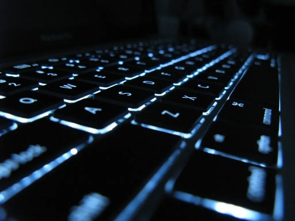 Internet Explorer Remote Code Execution Vulnerability 1 sleek, illuminated laptop keyboard showcasing modern design and functionality with blue backlighting.