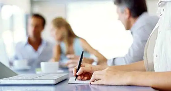 Corporate Computer Security: Tips And Advice 3 collaborative team meeting highlighting engaging discussions and creative note-taking in a bright setting.