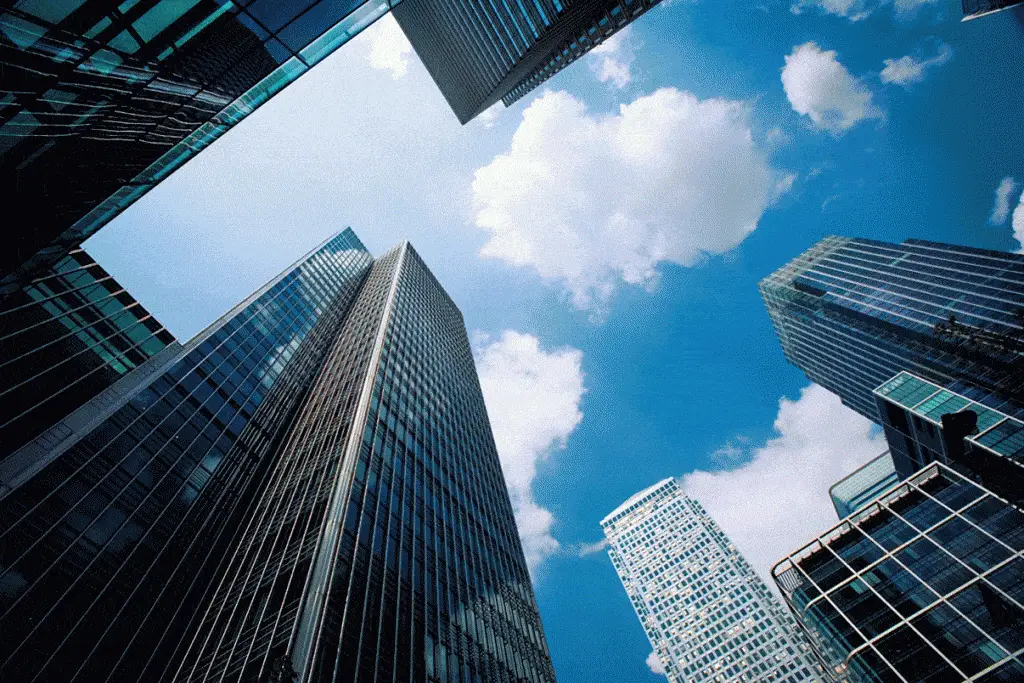 Find It Support On Long Island That Meets Your Needs 2 modern skyscrapers reflect the blue sky, highlighting urban ambition and the blend of nature and architecture.