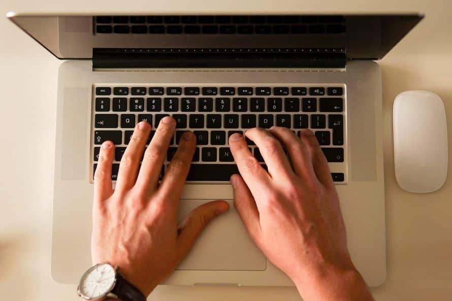 sleek laptop and wireless mouse in a productive workspace, enhancing creativity and efficiency.