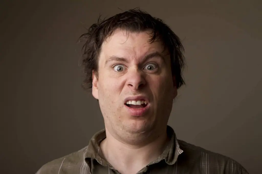 Managed It Services - Just What Are They Anyway? 7 man showing strong confusion with wide eyes, furrowed brow, and grimace in close-up portrait.