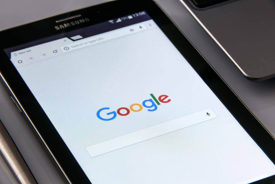 samsung tablet showcasing google search homepage in a modern multitasking workspace.