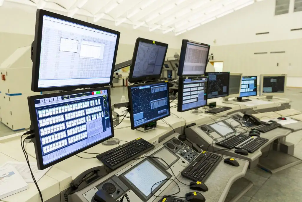 Factors To Consider When Controlling User Access 1 modern control room for efficient user access management with vibrant data displays and ergonomic controls.
