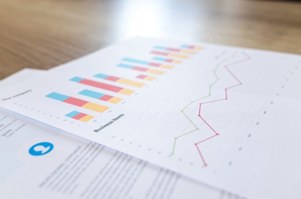 vibrant graphs and insights arranged on a wooden table for effective data presentation.