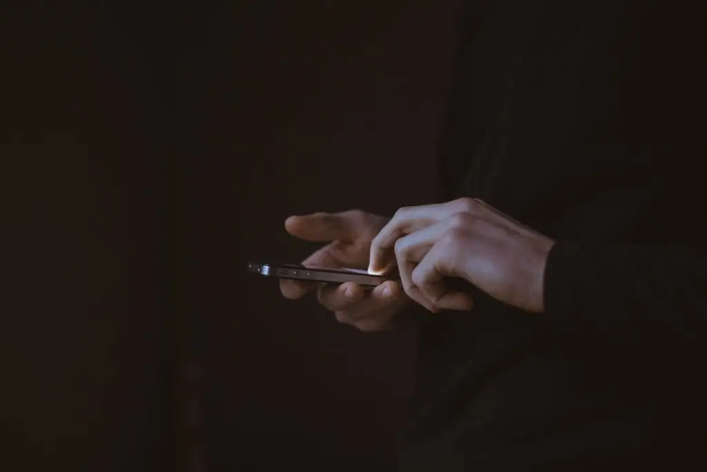 hands holding a smartphone, showcasing focus and connection in modern digital communication.