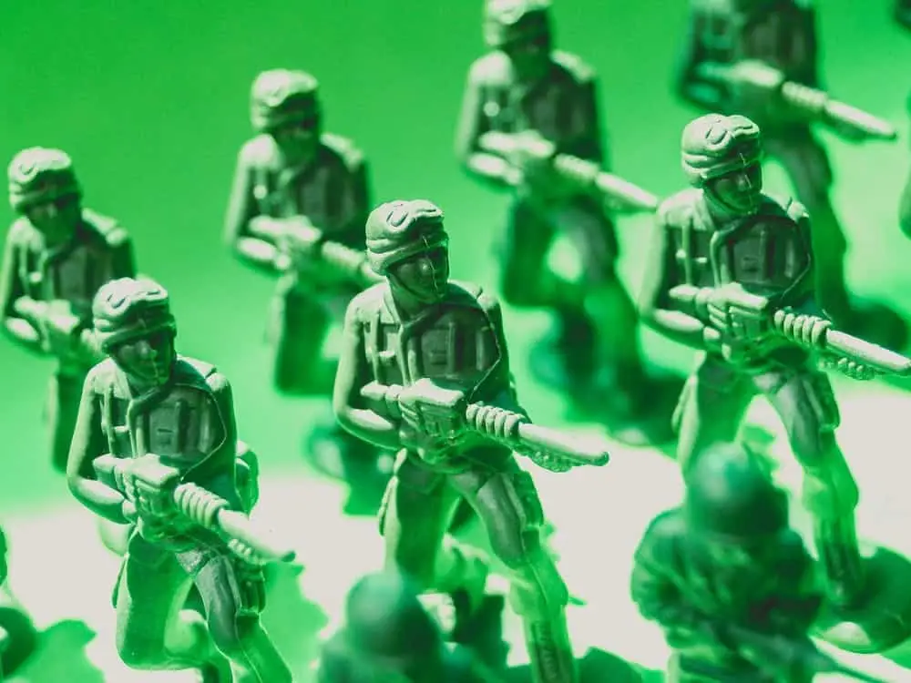 Dynamic scene of green toy soldiers ready for imaginative childhood military adventures.