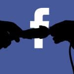 Switching off Facebook. Silhouette of person hands disconnecting plugs, symbol of Facebook global outage
