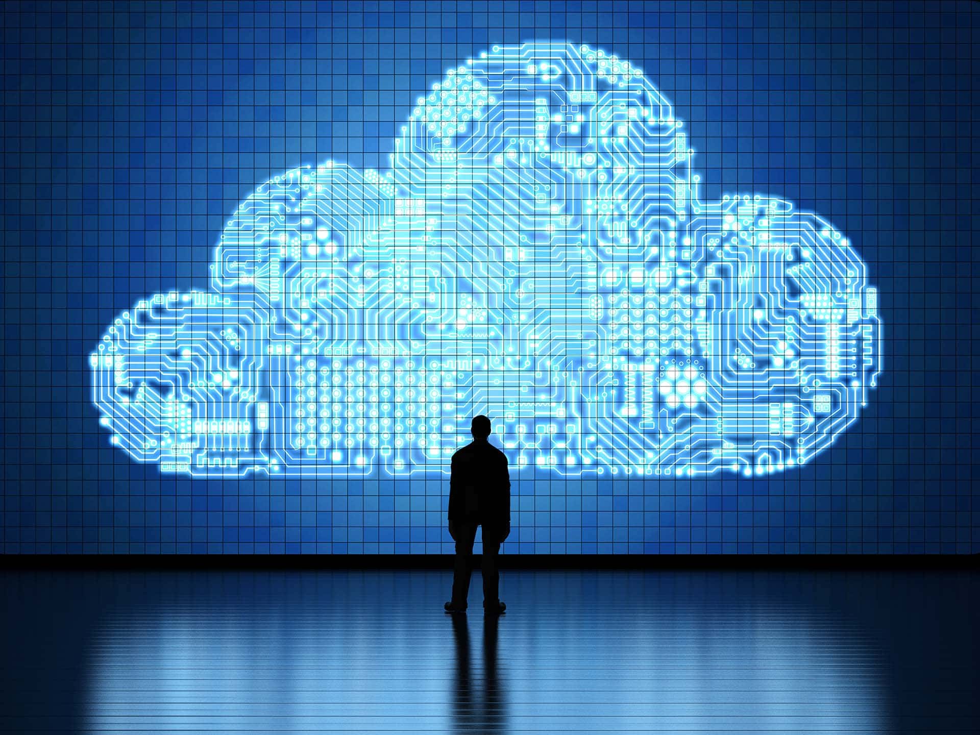 a man is standing in front of a cloud with circuit boards on it