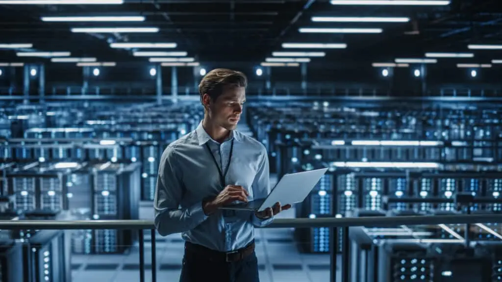 Advanced Technology Cybersecurity Risks And What To Do About It 4 it specialist managing cybersecurity in a data center with advanced server technology.